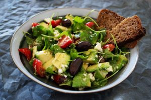 One of the links between diet and migraines can be seen when eating healthy food like this salad.