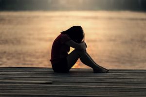 a sad woman seeking guidance and support through loss and grief